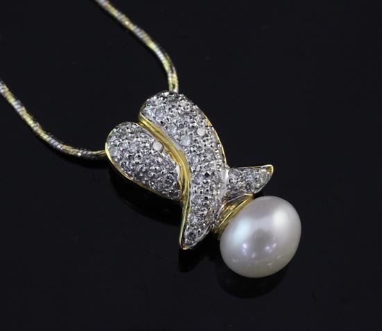 An 18ct gold, diamond and cultured pearl pendant, pendant 0.75in.